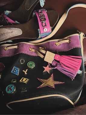 Dooney & Bourke Black Leather Drawstring Shoulder Bag with Pink Accents